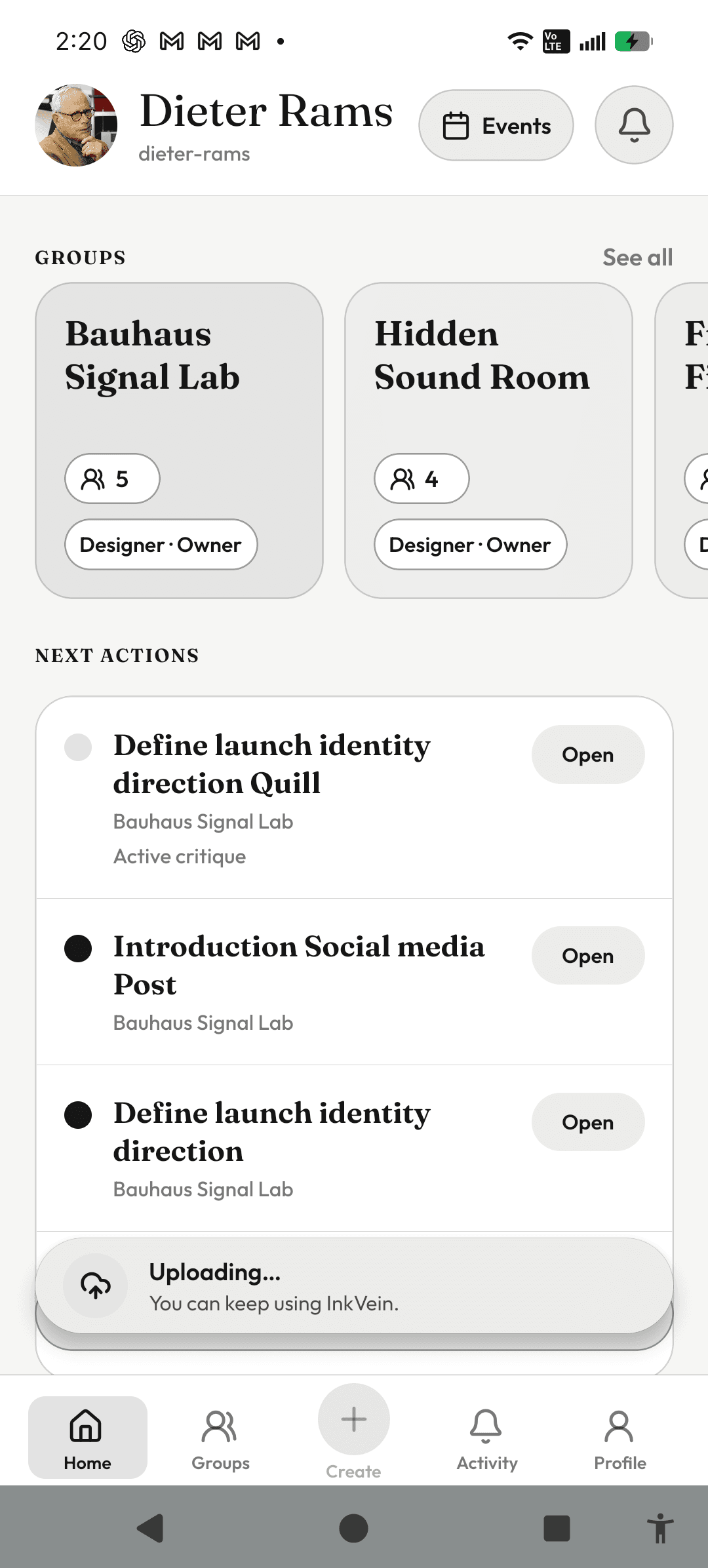 InkVein home screen with a persistent Uploading status surface above bottom navigation.